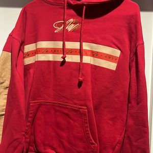 Jake Paul gold and red sweater